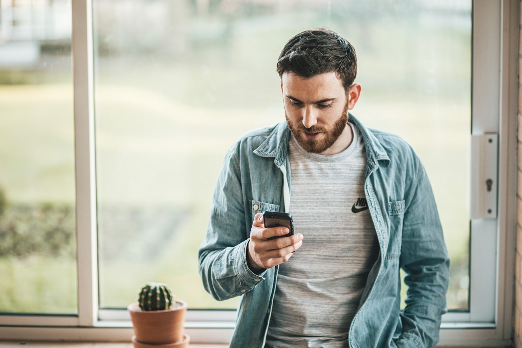 Cell - Man on Phone Near Window - Large.jpg